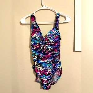 one piece swimsuit with a black white pink and blue pattern